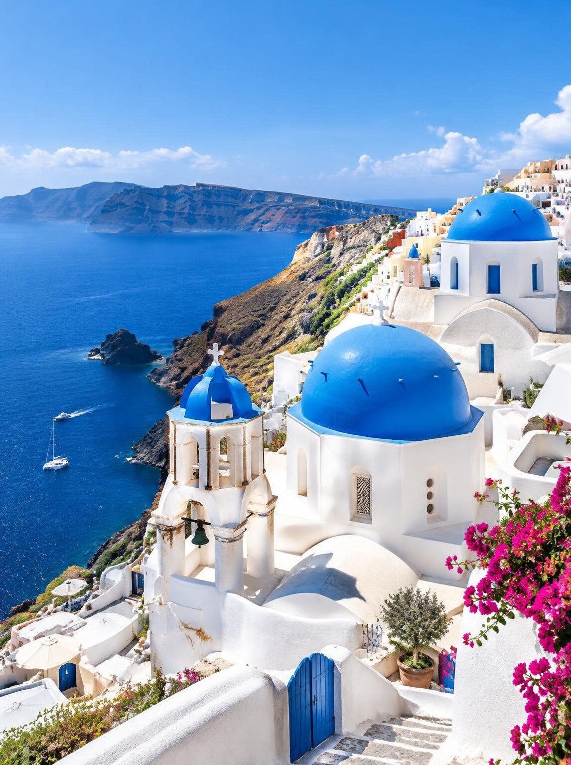 Santorini white houses with blue domes over the sea