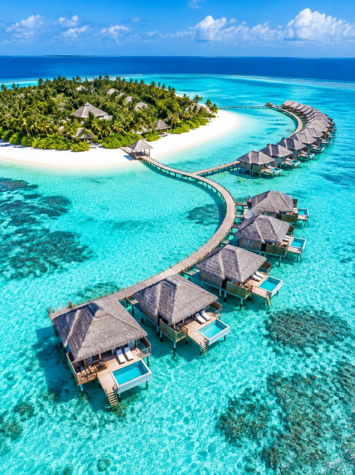 Maldives overwater villas on turquoise lagoon